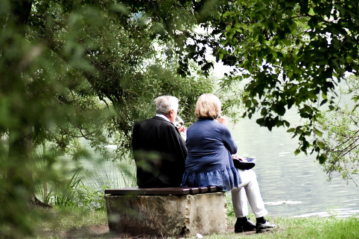 How Caregivers Can Help Medicare Recipients - two senior people sitting on a bench